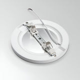 The Lucella Recessed Round LED Downlight - 20W, 4000K, White is an energy-efficient ceiling light fixture that combines style and functionality. It features a metal bracket for mounting and comes with a white power cable and two spring clips for easy installation. Set against a plain white background, this sleek downlight offers optimal lighting performance.