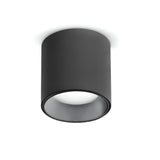 The Solace LED Round Downlight 4W 4000K in black is a modern fixture featuring a cylindrical design, mounted on a white ceiling. This downlight showcases a smooth, minimalist aesthetic by housing its light source within the cylinder, enhancing any space with its sleek appearance.