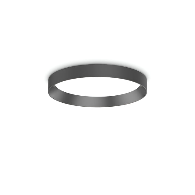 The Spark LED Flush Light 18W 4000K in black, with its minimalist circular design and sleek finish, is mounted on a white ceiling to deliver an energy-efficient lighting solution that effortlessly adds modernity to the space.