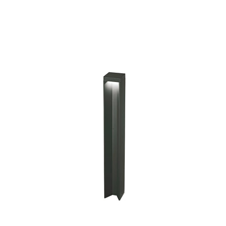 Introducing the Viritis Outdoor LED Bollard Light 12W 3000K in Black—a modern bollard with a minimalist rectangular design and dark finish. This weather-resistant light directs illumination downward, making it ideal for enhancing pathways or gardens.