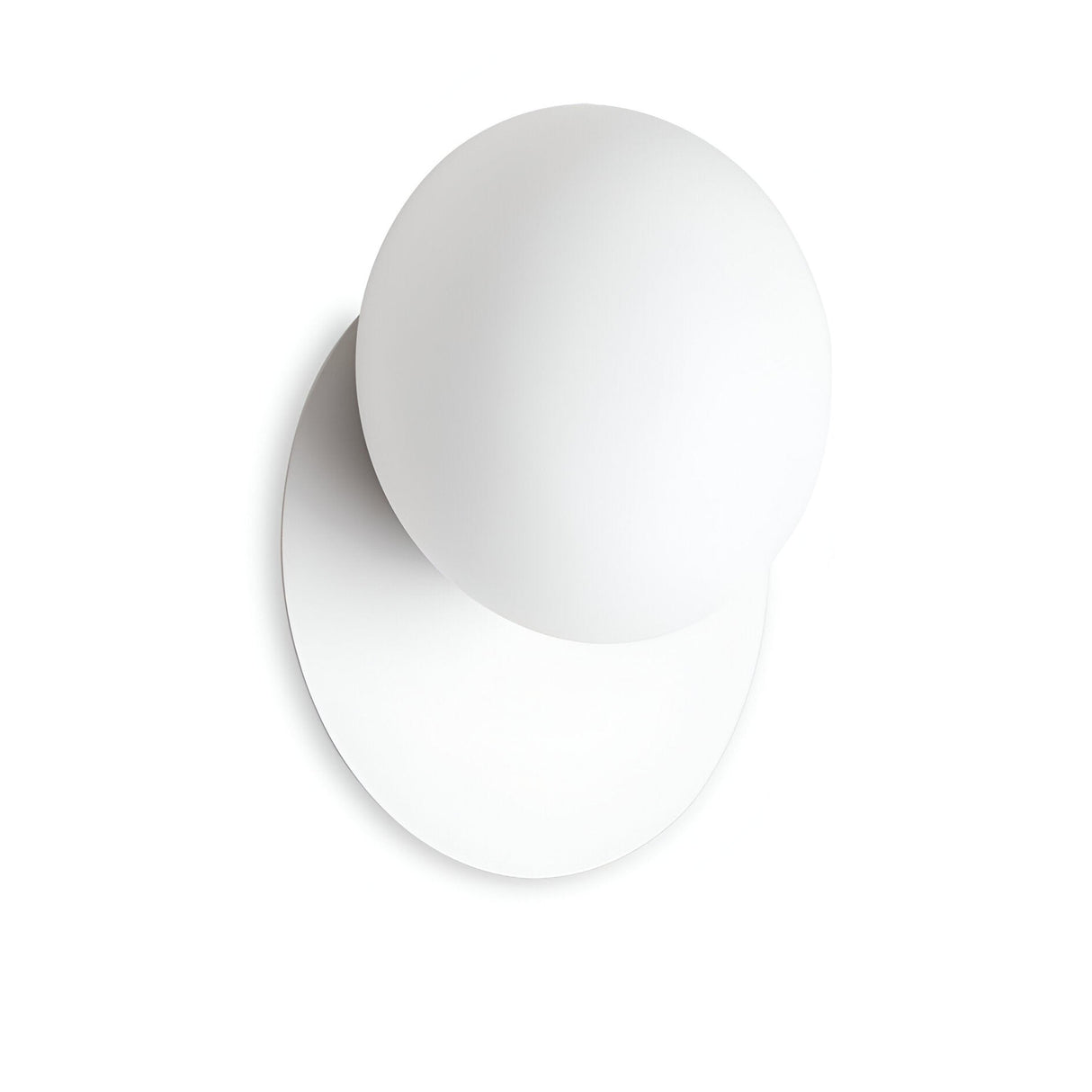 A minimalist design showcasing a white sphere intersecting with a flat circular base, reminiscent of the Halion Wall Light - White. The interplay of shapes casts a gentle shadow on a simple white background, highlighting simplicity and modernity with an ambient glow.