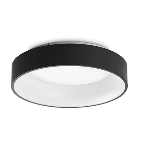 Introducing the Fluxis LED Flush Ceiling Light - Black, 45cm: a contemporary circular light with a sleek black rim and a smooth white diffuser. Elegantly mounted flush against any white ceiling, it is ideal for modern interiors. This energy-efficient lighting solution utilizes advanced LED technology to stylishly and effectively illuminate any space.