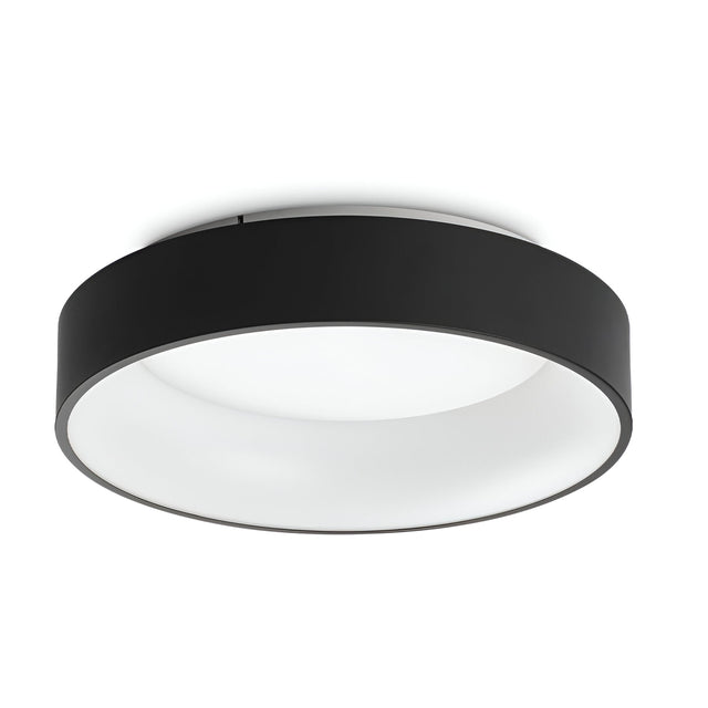 Introducing the Fluxis LED Flush Ceiling Light - Black, 45cm: a contemporary circular light with a sleek black rim and a smooth white diffuser. Elegantly mounted flush against any white ceiling, it is ideal for modern interiors. This energy-efficient lighting solution utilizes advanced LED technology to stylishly and effectively illuminate any space.