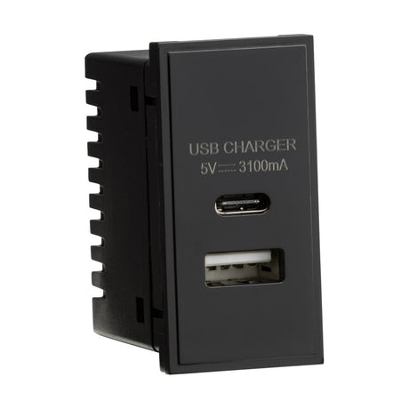 Introducing the stylish Dual USB (3.1A) Module 25 X 50mm in black, equipped with both a Type-C and a USB-A port. The front panel is labeled "USB CHARGER" and lists the specifications as 5V --- 3100mA. This device includes built-in overload protection for safe and efficient charging, offering you peace of mind.