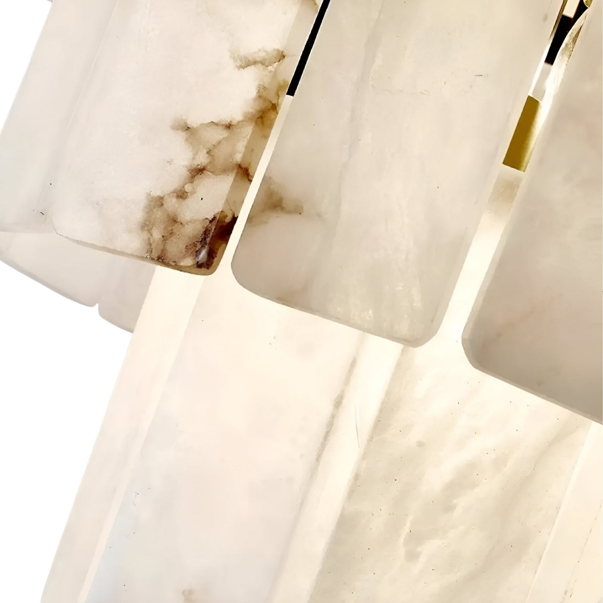 Close-up view of overlapping rectangular alabaster panels with subtle brown and grey veining, part of the Auravel 48 Light Extra Large Tiered Alabaster Chandelier in Soft White & Matte Black.