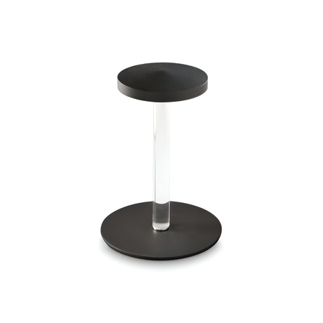 A modern, minimalist black side table featuring a circular base and top, connected by a transparent cylindrical support. Complement its sleek design with the Solixis LED Table Lamp 3.6W 3000K in black for an elegant and cohesive look.