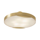 The Marea Round LED Alabaster Semi-Flush Ceiling Light in Brushed Brass features a modern design with a round metal frame and an alabaster diffuser.
