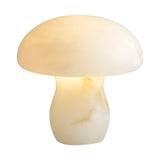 The Morfia 1 Light Extra Large Mushroom Alabaster Table Lamp in Natural Brass, crafted from white marbled alabaster, emits a warm glow and features a sculptural mushroom silhouette against a plain white background.