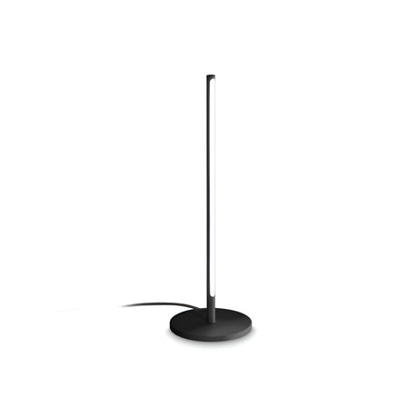 Introducing the Celestia LED Table Lamp - Black, showcasing a sleek, black finish and a slender vertical light strip on a circular base against a white background. This lamp embodies modern lighting elegance and includes an extending power cord from the base.