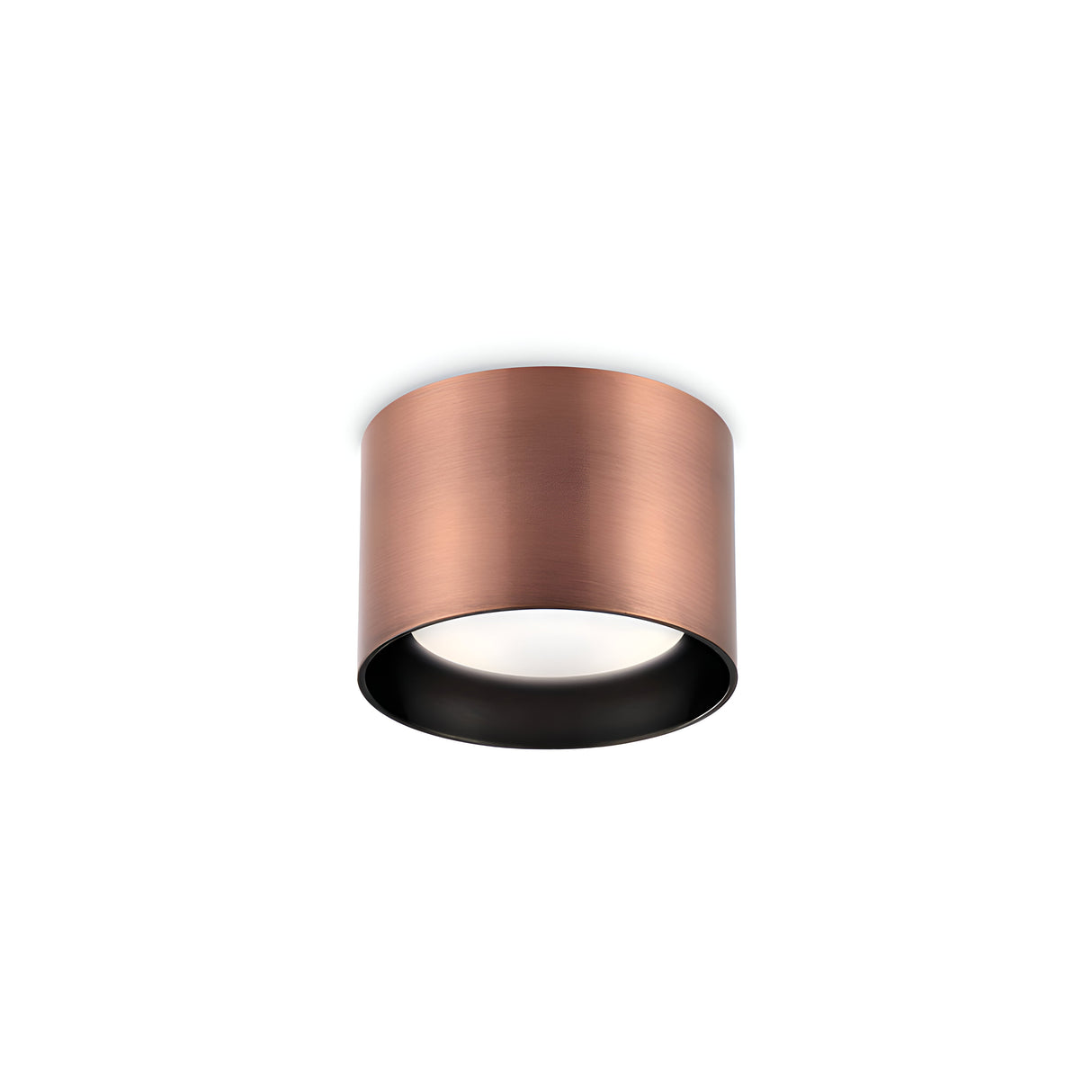 The Orbis Round Downlight - Copper is a ceiling-mounted fixture with a cylindrical, metallic casing and a white light diffuser at its base. Its smooth exterior contrasts with the dark interior, making it perfect for modern interiors. The replaceable LED provides both longevity and adaptability.