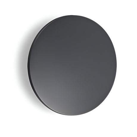 A sleek, round, black mirror hangs on a plain white wall, effortlessly complementing the minimalist, modern aesthetic. Nearby, an Eclipseax Outdoor LED Wall Light in grey softly illuminates the surroundings with its energy-efficient 9W 3000K warm glow at 18cm, adding subtle elegance to the scene.