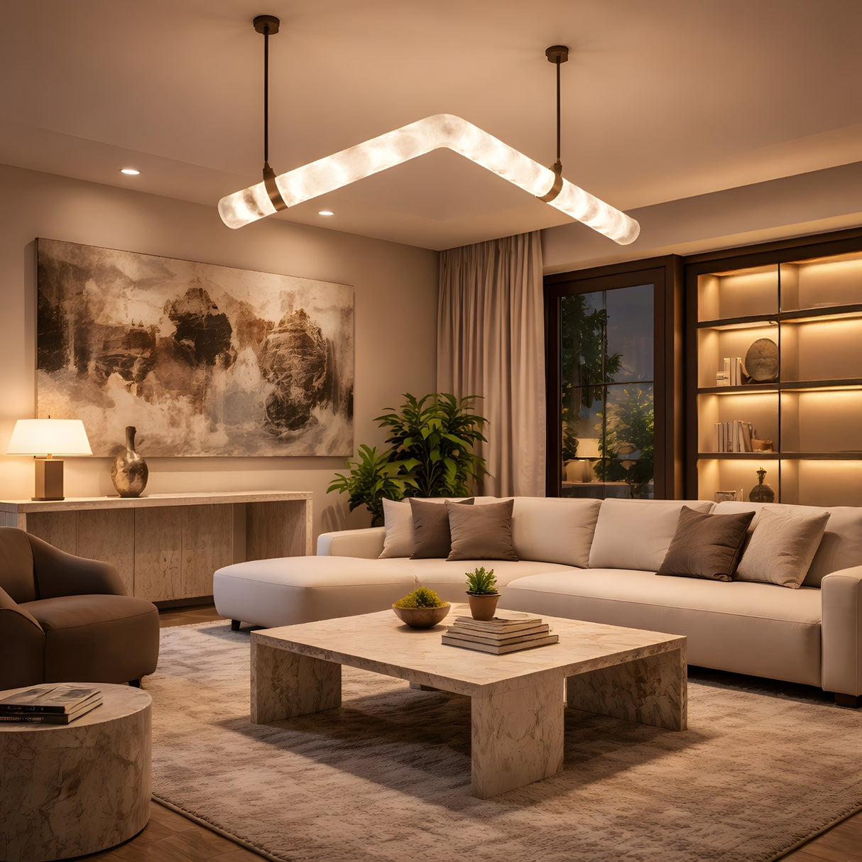 Niori Zareon chevron alabaster chandelier with brushed brass collars glows warm above a neutral living room with cream sofa and marble coffee table.