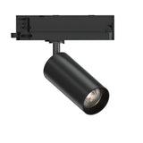 The Glimmara LED Three Phase Track Spotlight 21W 3000K in black showcases a chic cylindrical design and an adjustable head on a rectangular mounting fixture. Offering energy-efficient lighting angled downward, it delivers precise directional illumination, merging modern elegance with functionality.