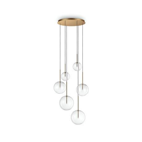 The Solarae 6 Light Cluster Pendant - Brass is a contemporary lighting fixture that showcases a gold circular base and six glass orbs hanging at different heights, suspended by slender rods. The clear orbs offer a minimalist and elegant design.