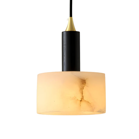 The Draxen 1 Light Drum Alabaster Single Pendant Light features a soft white cylindrical alabaster shade with subtle marbling and a matte black fixture, suspended by a black cord for a modern look.