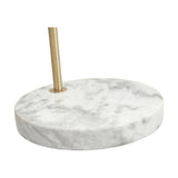 Close-up of the Feliciani floor lamp's round white marble base with veining, fitted with a brushed brass rod, shown on a plain white background.