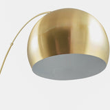 Close-up of the Feliciani floor lamp's dome-shaped shade in brushed brass with a white interior, shown on a plain light background.