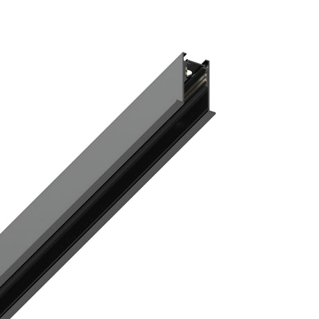 Image of a long, slender Luxeon-2 Recessed Magnetic Track 2m - Black with a matte finish and smooth surface, featuring an open channel along its length. The end section displays a clean, angular cut revealing its hollow interior, set against a plain white background.