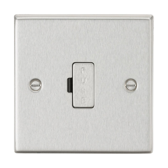 A close-up of the 13A Fused Spur Unit in brushed chrome highlights its square edge design with an integrated fuse. The surface is elegantly finished, featuring two screws on either side, and the fuse is prominently labeled vertically at the center.