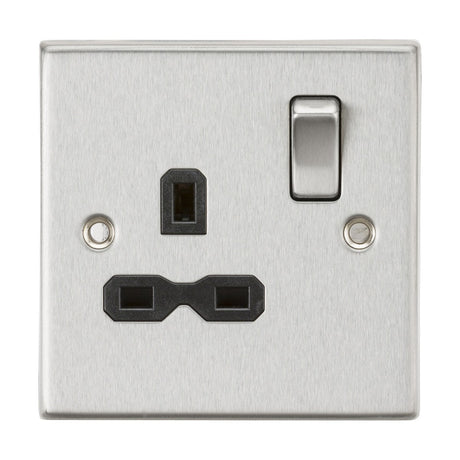 The 13A 1 Gang DP Switched Socket in brushed chrome, featuring a black insert and square edge design, includes one UK plug socket and an additional two-prong socket that accommodates shavers or similar low-power devices.