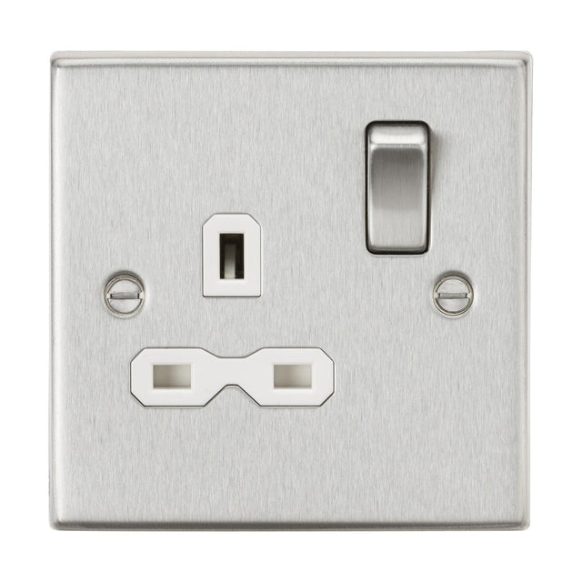 The 13A 1 Gang DP Switched Socket in brushed chrome with a white insert and square edge design features a single switch and three rectangular pinholes for a plug. It has two screws on either side of the central socket for easy mounting, adding a decorative touch to any room.