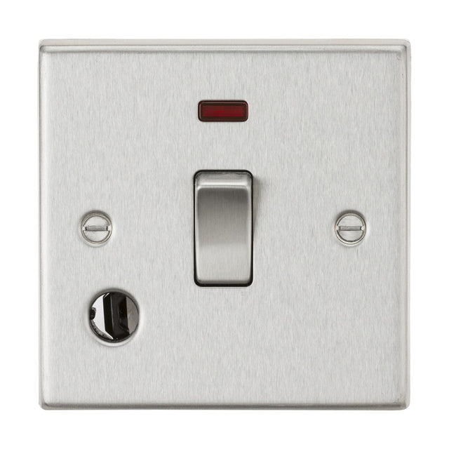 A 20A 1 Gang DP Switch Neon & Flex Outlet - Brushed Chrome (Square Edge) installed on a wall, showcasing a single toggle with a small red neon indicator light above it. The switch plate, perfect for managing water heaters, comes with two screws and includes a circular flex outlet on the bottom left.