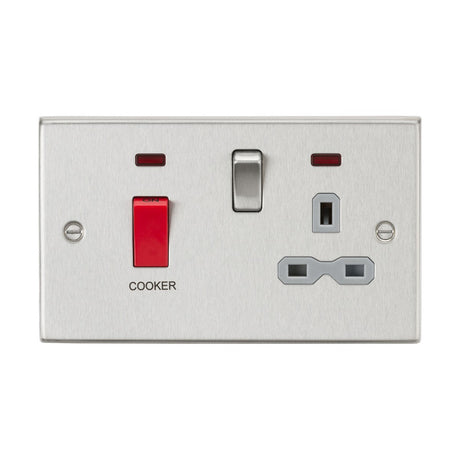 The 45A DP Switch & 13A Socket Neons - Brushed Chrome (Grey Insert, Square Edge) includes a metallic dual wall socket featuring a 45A cooker switch alongside a standard switch, with an integrated three-pin plug outlet, all presented in an elegant brushed chrome finish.