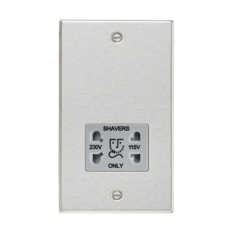 The 115/Dual Voltage Shaver Socket in brushed chrome features a square edge design with a grey insert. It offers dual voltage options of 230V and 115V, is marked with "SHAVERS ONLY" in bold black text, and includes a plug compatibility diagram.