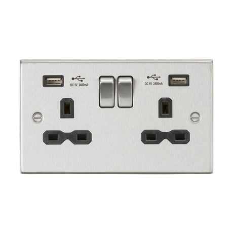 The 13A 2 Gang SP Switched Socket with Dual USB in Brushed Chrome features a decorative square edge design and includes two plug outlets alongside dual USB chargers. The metallic finish highlights two central switches, and each USB port is conveniently labeled with DC 5V 2400mA.