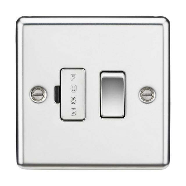 The 13A Switched Fused Spur Unit in polished chrome features a rounded edge metal design with a rectangular switch on the right and a vertical fuse holder labeled FUSE on the left. Mounted against a white background, it is secured with two screws, emphasizing its functional design.