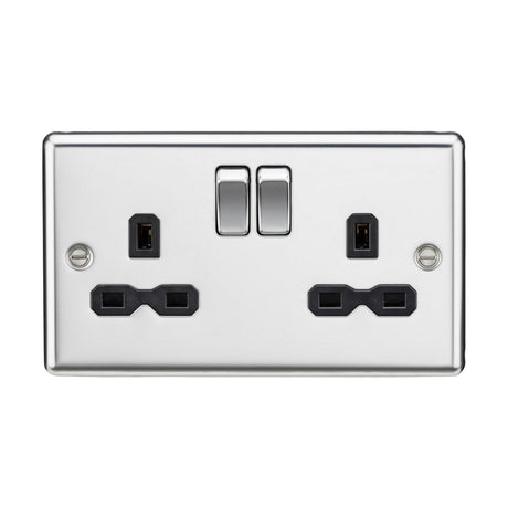 The 13A 2 Gang DP Switched Socket with Twin Earths in polished chrome, featuring a black insert and rounded edge, offers two decorative touch switches alongside plug inputs for UK-style three rectangular prong plugs. It includes double pole switches for enhanced safety.