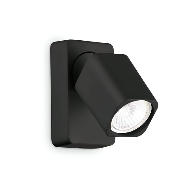 The Sparkeon-2 Single Spotlight - Black features a modern black finish with a square backplate and an adjustable rectangular lamp head, offering bright white adjustable lighting. Its minimalistic and sleek design makes it an ideal choice for contemporary interiors.