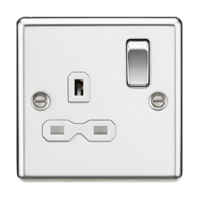 A 13A 1-gang DP switched socket with a white insert, featuring two plug sockets and a single switch, is adorned with a polished chrome plate and rounded edges for an elegant appearance. The glossy finish and two visible screws contribute to its sophisticated look.