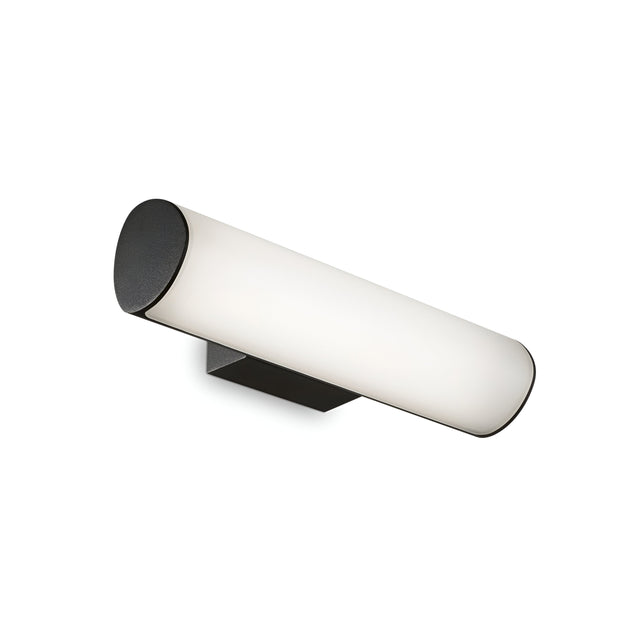 The Glintis LED Bathroom Mirror Light 9.5W 3000K - Black showcases a sleek, modern design with a cylindrical white shade and black end caps, mounted on a black rectangular base. Featuring an opal diffuser for energy-efficient illumination, its minimalist style provides a contemporary touch suitable for various interior settings.