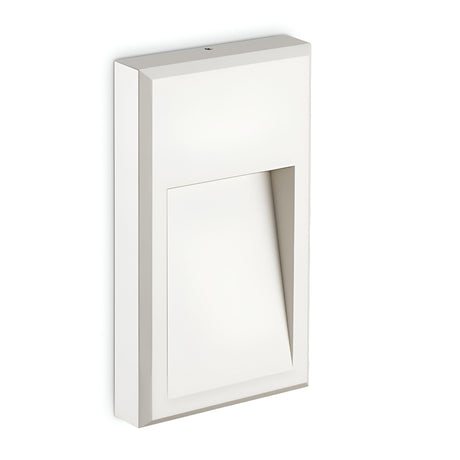The Arcana-2 LED Outdoor Wall Light 6W 4000K - White boasts a minimalist geometric design with a rectangular base and an angled cutout, creating a modern and sleek look. This energy-efficient wall sconce is ideal for illuminating against a simple backdrop.