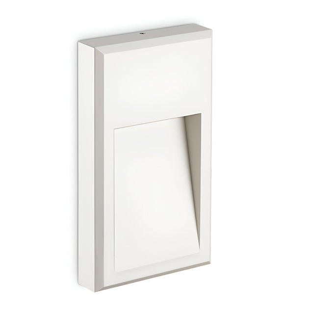 The Arcana-2 LED Outdoor Wall Light 6W 4000K - White boasts a minimalist geometric design with a rectangular base and an angled cutout, creating a modern and sleek look. This energy-efficient wall sconce is ideal for illuminating against a simple backdrop.