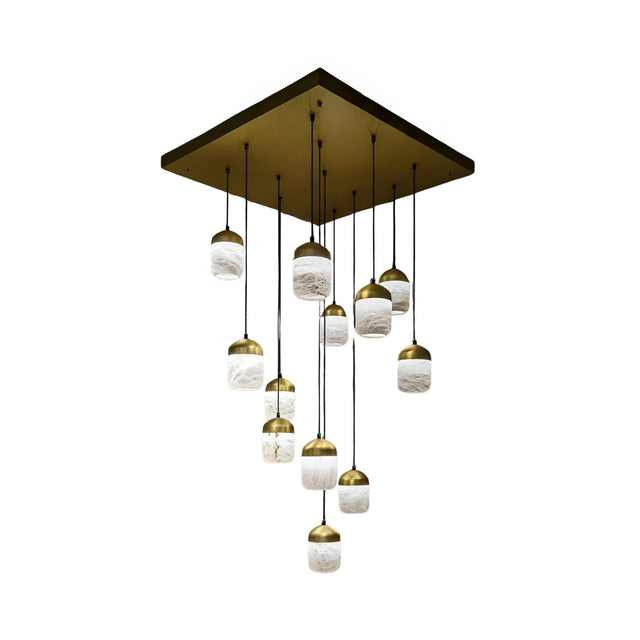 The Valmora LED Cascade Globe Alabaster Cluster Pendant Light - Soft White features a modern square brass base and multiple round white shades with brass tops, suspended at varying lengths for a cascading chandelier effect.