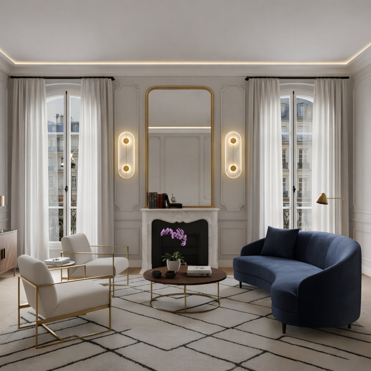 Elegant living room with tall windows, white curtains, a large wall mirror above the fireplace, Elaris LED Capsule Alabaster Wall Light in Soft White & Brass, navy curved sofa, two white chairs, round wooden coffee table, and geometric rug.