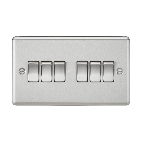 The 10AX 6 Gang 2-Way Switch - Brushed Chrome, features six horizontal rocker switches arranged in two rows of three. Designed for modern interiors with a sleek brushed chrome finish, it’s mounted against a white background.