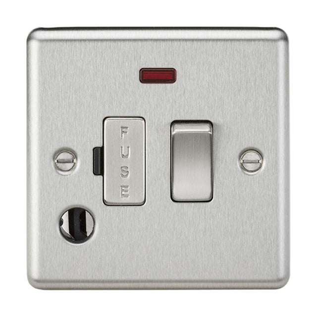 The 13A Switched Fused Spur Unit Neon & Flex Outlet in Brushed Chrome (Rounded Edge) comes with a switch, an embossed FUSE holder, and a small neon indicator light above the switch to indicate active power. Two screws are located at the corners of this setup.