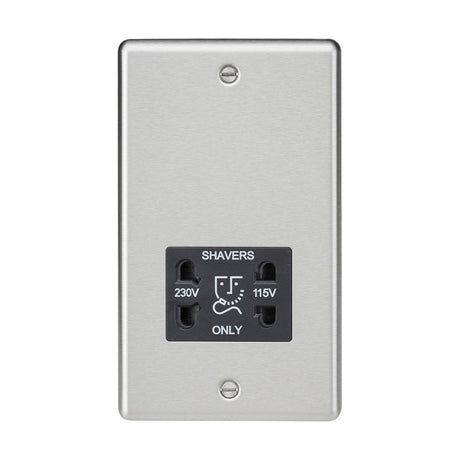 The 115/Dual Voltage Shaver Socket features a brushed chrome finish with a black insert and rounded edge design. It is wall-mounted and labeled "Shavers Only," providing both 230V and 115V options with two plug slots, secured by two screws for a decorative touch.