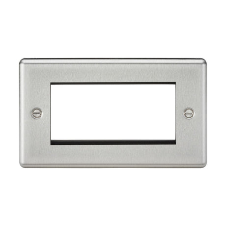 The 4 Gang Modular Faceplate in brushed chrome with a rounded edge features a rectangular design, a large central cutout, and two mounting screws, making it ideal for accommodating euro module installations for TV/DATA/HDMI/USB/TEL setups.