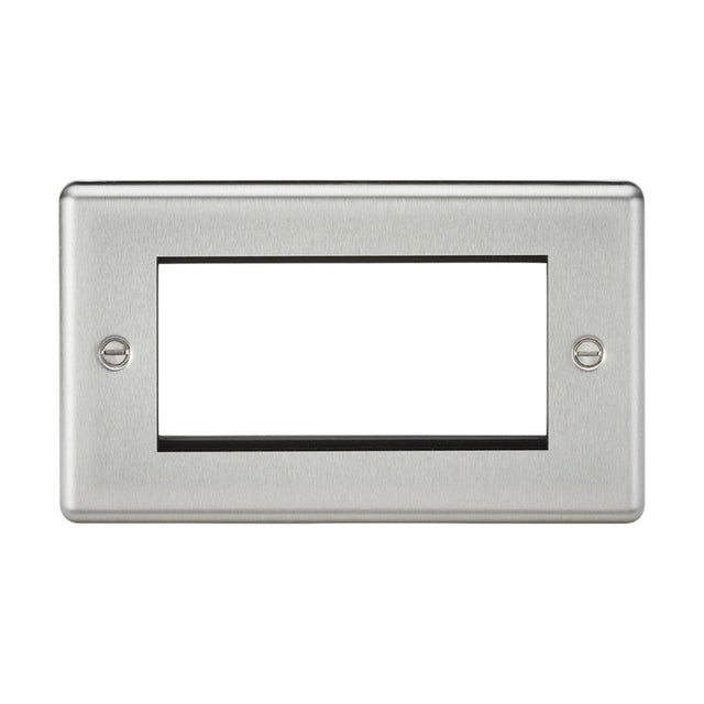 The 4 Gang Modular Faceplate in brushed chrome with a rounded edge features a rectangular design, a large central cutout, and two mounting screws, making it ideal for accommodating euro module installations for TV/DATA/HDMI/USB/TEL setups.