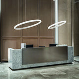 Miracle ring pendant lights above a reception desk