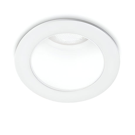 The Clarion LED Recessed Downlight - 3W, CRI90, 3000K in white is a circular light with a smooth, flat trim. This energy-efficient downlight is currently on, producing a soft glow from its textured, slightly domed center. Its modern design ensures true-to-life color rendering and integrates seamlessly with the ceiling to maintain a minimalist aesthetic.