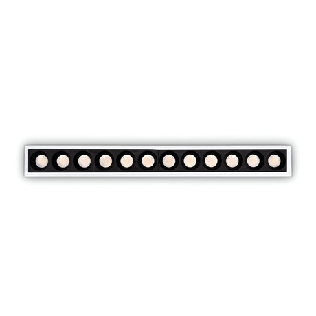The Phosix Slim LED Recessed Downlight, a sleek white fixture equipped with 10W power and emitting a warm 3000K glow, blends modern style with energy-efficient lighting through its circular lights softly illuminating the space against a contrasting black background.
