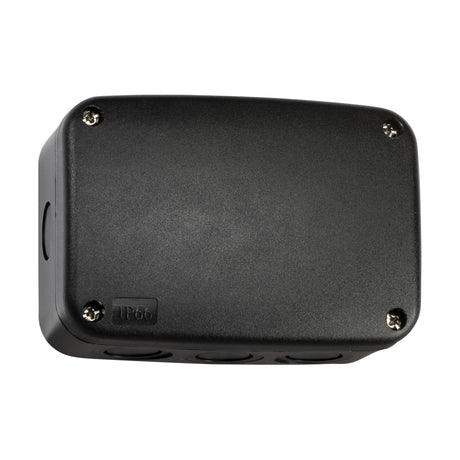 The IP66 Outdoor Enclosure, Medium - Black is a rectangular junction box designed with four screws to secure the lid. Its surface boasts an IP66 rating, ensuring it is dust-tight and water-resistant. Constructed from impact-resistant polycarbonate, it includes cylindrical knockouts on the sides for cable entry.