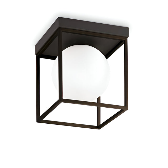 The Dawn 1 Light Flush - Black features a sleek and contemporary design, with a modern black square geometric metal frame surrounding a white spherical bulb, adding a minimalist style to any room.