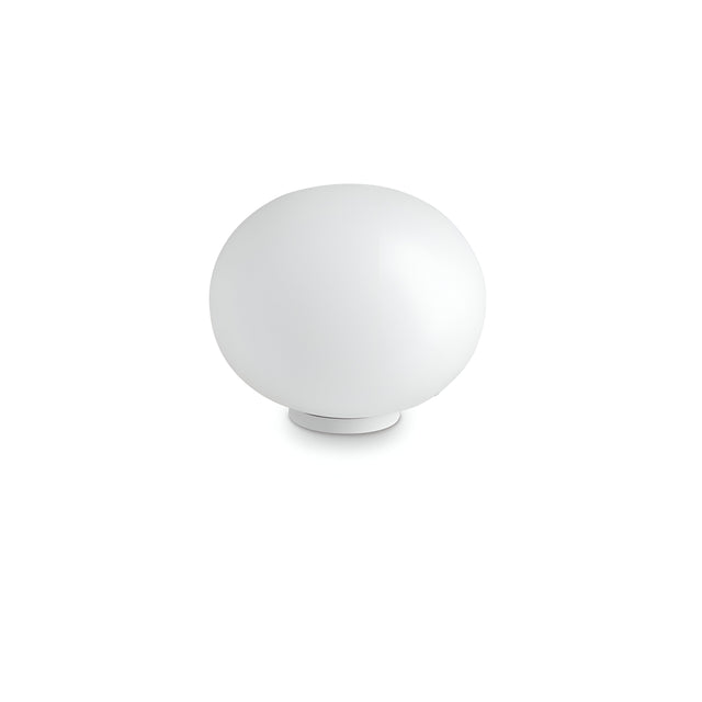 The Orlix Medium Table Lamp - White showcases a smooth, spherical form and minimalist design. Its acid-etched glass diffuser beautifully complements the simple base, elegantly set against a white backdrop.