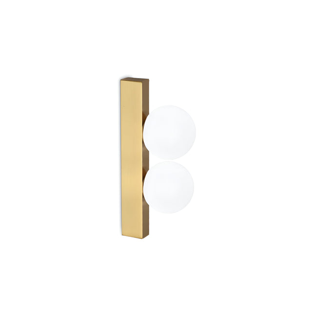 The Lyria 2 Light Ceiling & Wall Light 6W 3000K - Gold showcases a minimalist aesthetic with its rectangular brushed brass base, elegantly supporting two vertically aligned round white glass globes. These globes resemble light bulbs, offering a contemporary and sophisticated charm.